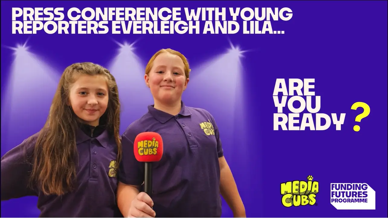 Two young reporters, Everleigh and Lila, stand confidently in purple Media Cubs polo shirts. One holds a microphone with a red “Media Cubs” logo. The background is deep purple with spotlights shining down. Bold white and yellow text reads, “PRESS CONFERENCE WITH YOUNG REPORTERS EVERLEIGH AND LILA… ARE YOU READY?” The “Media Cubs” and “Funding Futures Programme” logos are displayed in the bottom right corner.